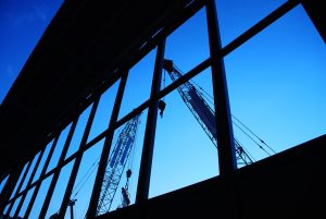 Cranes in the reflection of glass windows